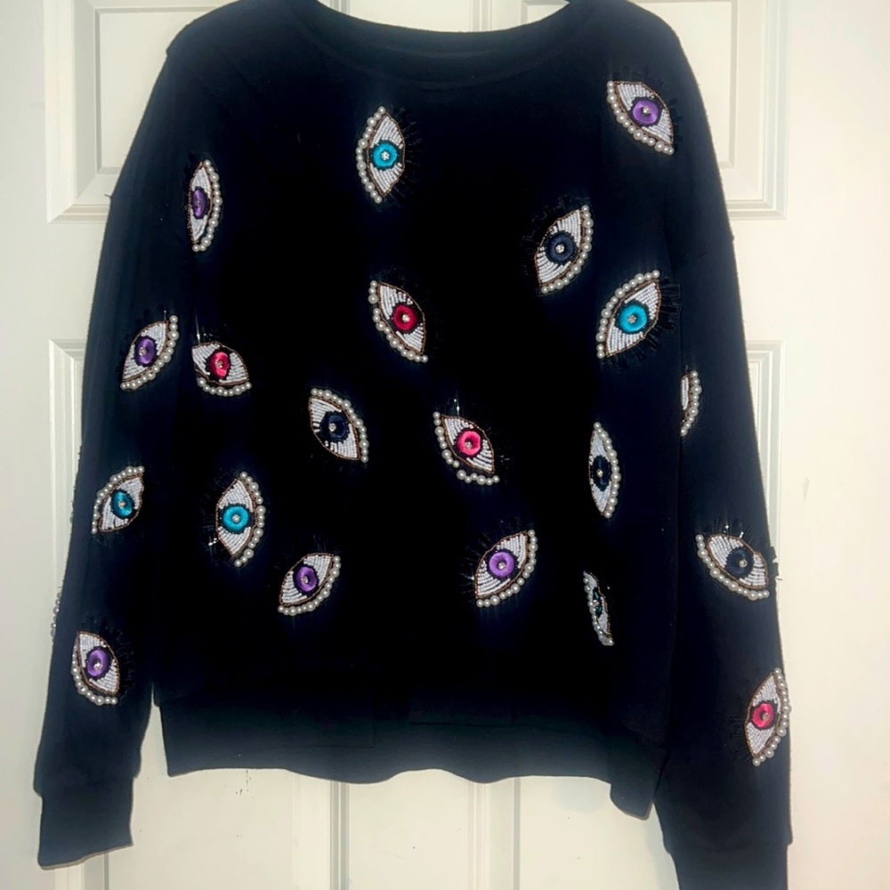 Black sweatshirt with sewn in beads